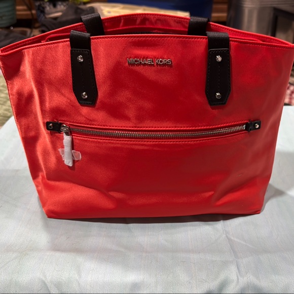 Michael Kors Handbags - Michael Kors orange  and Black Luggage Travel Bag